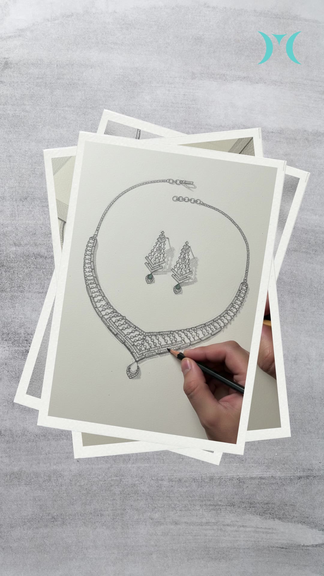 A Mani designer hand-sketching a necklace set